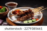 Satay Skewered and Grilled Meat, Served with Spicy Salad, Cucumber, Chili, and Soy Sauce
