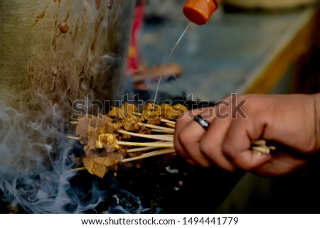 Similar – Würstchen und Maiskolben im Grill gekocht