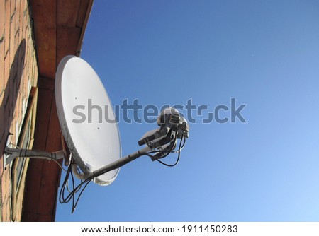 
Satellite dish covered with frozen snow, ice
