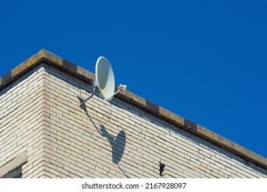 The satellite dish is installed on the roof of the house