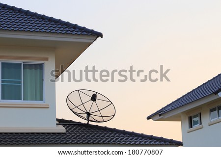 Satellite dish and TV antennas on the house roof