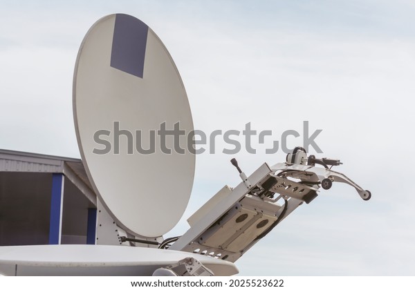 Satellite dish for TV broadcast and live broadcast on\
the roof of the car