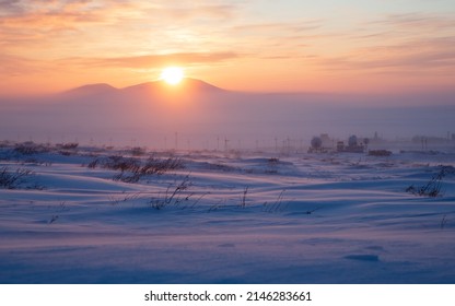 Satellite Dishes In The Winter Snow-covered Tundra In The Arctic. Sunset Over The Tundra And Mountains. Cold Frosty Winter Weather. Winter Arctic Landscape. Chukotka, Siberia, Far North Of Russia.