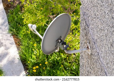 Satellite TV Dish On The Wall