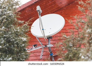 Satellite TV Dish, Sleet And Strong Wind Knocks Down The Internet And TV Service Satellite Signal