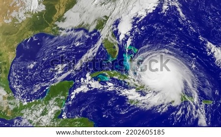 Satellite view of a hurricane. Aerial view of white clouds. Storm or tornado or typhoon photo taken from space. Elements of this image furnished by NASA.