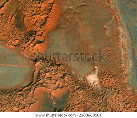 Satellite view of Libyan Desert, landscape and mountains. Dunes. Sahara Desert. Nature and aerial view. Global warming and climate change. Element of this image is furnished by Nasa Сток-фото © 