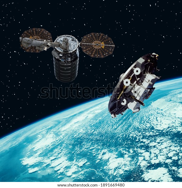 Satellites above the earth. The elements of this\
image furnished by\
NASA.
