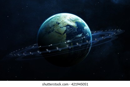 Satellites surrounding the planet Earth. Elements furnished by NASA
