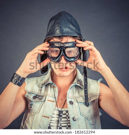 Similar – Man observing something through binoculars