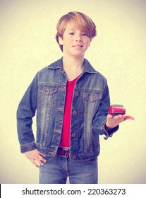 Satisfied Boy Holding A Toy Car