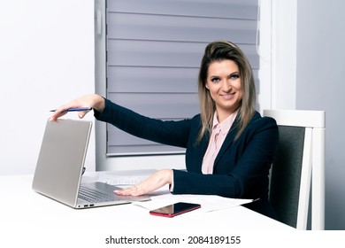 Satisfied Business Woman Quits Work And Closes The Laptop