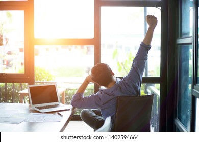 Satisfied Businessman Relaxing Leaning Back, Enjoying Break At Workplace, Happy Man Thinking About Successful Business Project, Strategy, Finish Work With Laptop, Dreaming