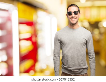 Satisfied cool young man posing