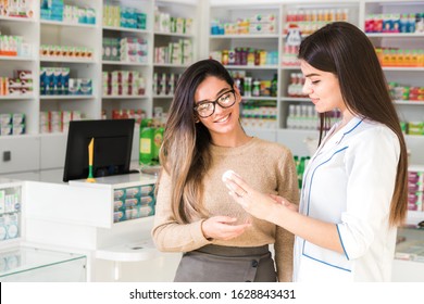 satisfied customer. professional consultation in pharmacy. confident pharmacist consults a client about a product in pharmacy - Powered by Shutterstock