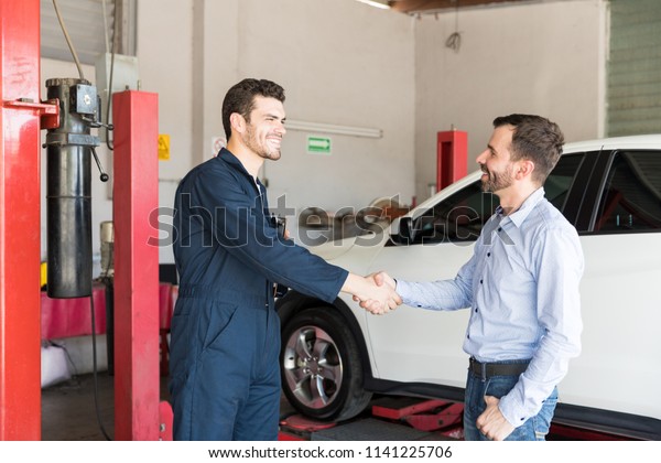 Satisfied Customer Shaking Hands Car Mechanic Stock Photo 1141225706 ...