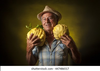 Satisfied Farmer Portrait With Two Giant Cedars Fruit Around The Neck.  Black And Yellow Background