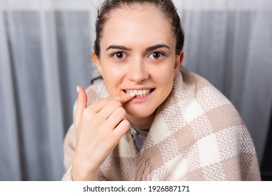 A Satisfied Girl At Home With A Smile Points To The Camera With A Forefinger At White Healthy Teeth. Dentistry. Dental Care.