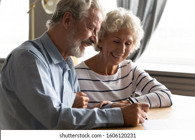 Satisfied Senior Couple At Lawyer Office Signing Prenuptial Agreement Marriage Articles, 70s Spouses Make Decision Buying Medical Life Health Insurance, Concept Of Testament Last Will And Inheritance