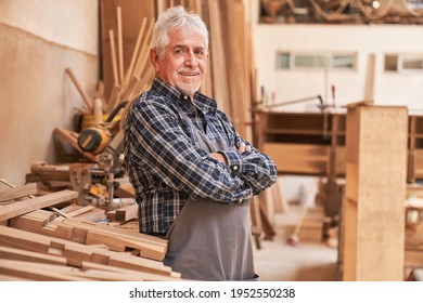 Satisfied senior as a master carpenter in his carpentry workshop with wood - Powered by Shutterstock