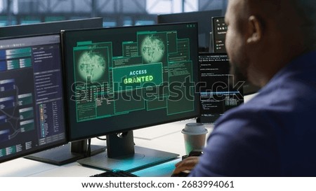 Satisfied server hub programmer pleased after installing cybersecurity framework, seeing access granted notification after reducing security incidents and enhancing data protection protocols, camera A