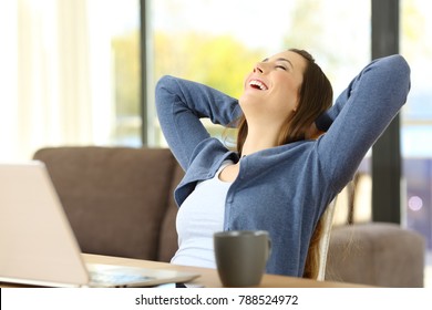 Satisfied Tenant Relaxing Sitting On A Chair At Home