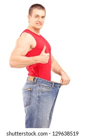 Satisfied Weight Loss Man In A Pair Of Old Jeans Giving A Thumb Up