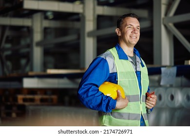 Satisfied Worker Standing At Distribution Warehouse And Looking Away. Copy Space.