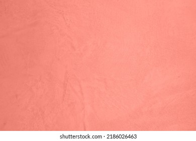 Saturated pastel pink colored low contrast Concrete textured background. Empty colourful wall texture with copy space for text overlay and mockups. 2023, 2024 color trend