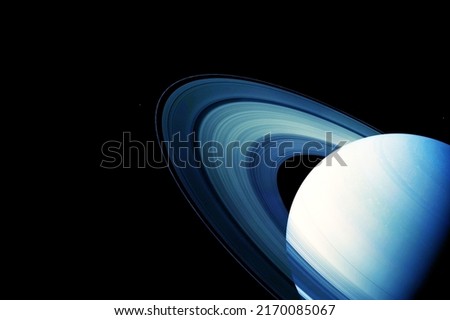 Saturn in unusual colors, on a dark background. Elements of this image were furnished by NASA. . High quality photo