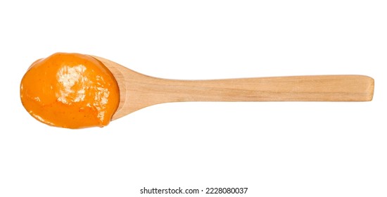 Sauce cocktail with brandy and fruity undertone in wooden spoon isolated on white - Shutterstock ID 2228080037