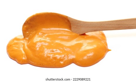 Sauce cocktail with brandy and fruity undertone in wooden spoon isolated on white - Shutterstock ID 2229089221