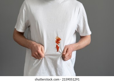 sauce dirty stain spot on the clothes, white t-shirt issue - Shutterstock ID 2159051291