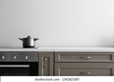 Saucepan On Electric Stove On Counter In Kitchen