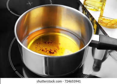 Saucepan With Used Vegetable Oil On Stove