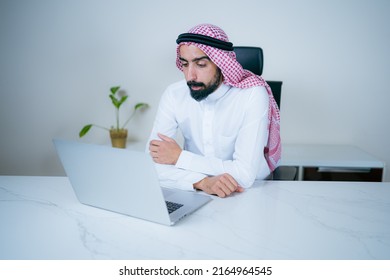 Saudi Arab businessman working using laptop in office. Arabian man from Saudi Arabia in virtual meeting