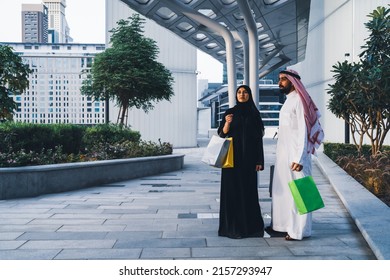 Saudi Arab Family Shopping Outdoor. Muslim Couple Happy Enjoying Shop Day Wearing Traditional Dress