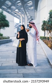 Saudi Arab Family Shopping Outdoor. Muslim Couple Happy Enjoying Shop Day Wearing Traditional Dress