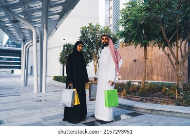 Saudi Arab Family Shopping Outdoor. Muslim Couple Happy Enjoying Shop Day Wearing Traditional Dress