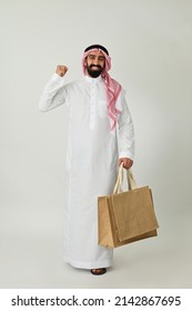 Saudi Arab Man Carrying Recyclable Shopping Bags Eco-friendly Reusable  Happy Isolated On Solid White Background