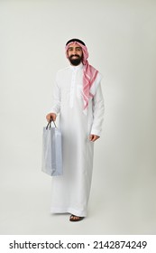 Saudi Arab Man Carrying Shopping Bags Happy Isolated On Solid White Background