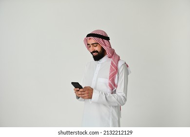 Saudi Arab Man Happy On Mobile Phone Reading Or Typing Message