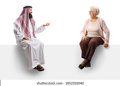 Saudi Arab Man On A Blank Panel Talking To An Elderly Man Isolated On White Background