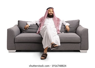 Saudi Arab Man Resting On A Gray Sofa Isolated On White Background