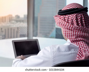 Saudi Arab Man Watching Laptop At Work And Contemplating