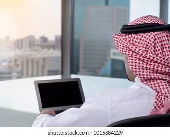 Saudi Arab Man Watching Laptop At Work And Contemplating