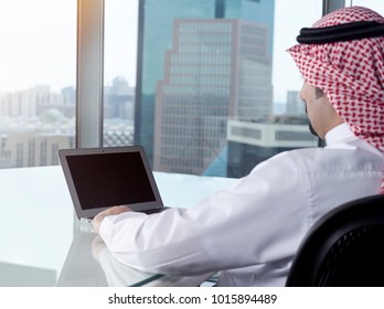 Saudi Arab Man Watching Laptop At Work And Contemplating