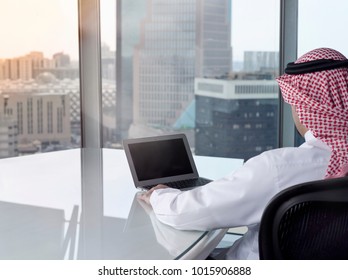 Saudi Arab Man Watching Laptop At Work And Contemplating