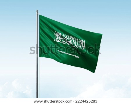  Saudi Arabia flag in the blue sky. 