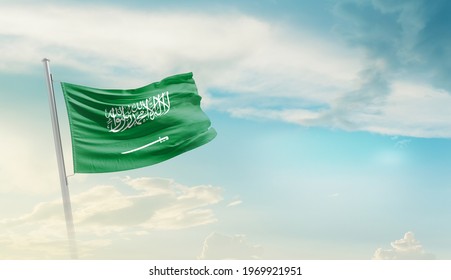 Saudi Arabia National Flag Waving In Beautiful Sky.